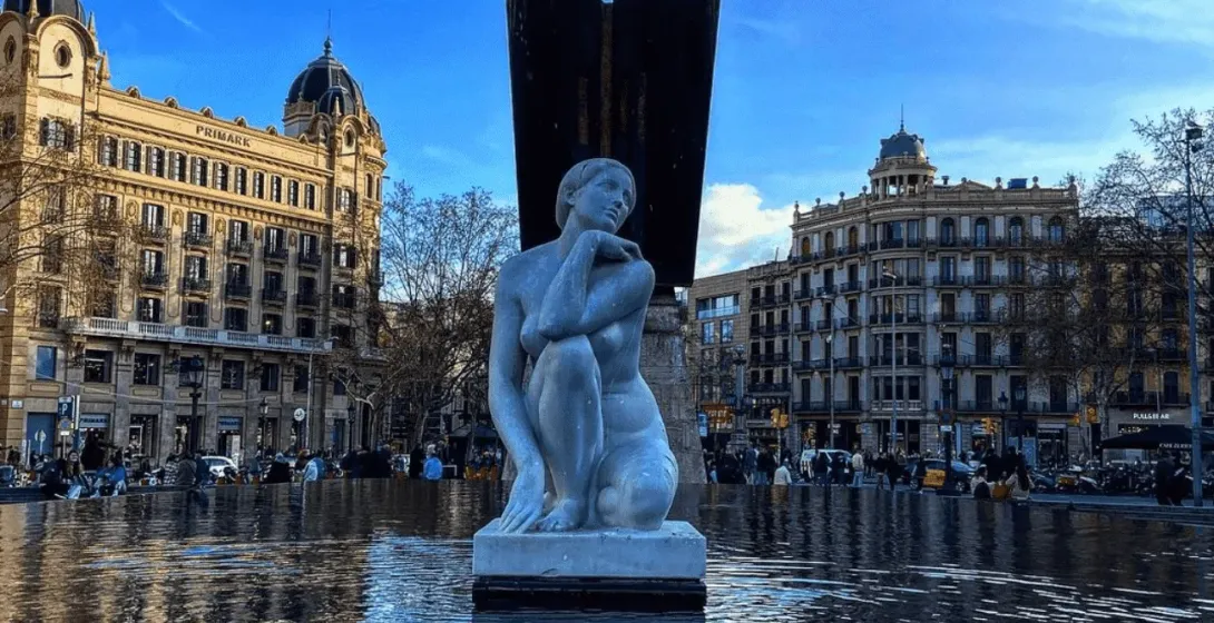 Serene statue in a Barcelona fountain.