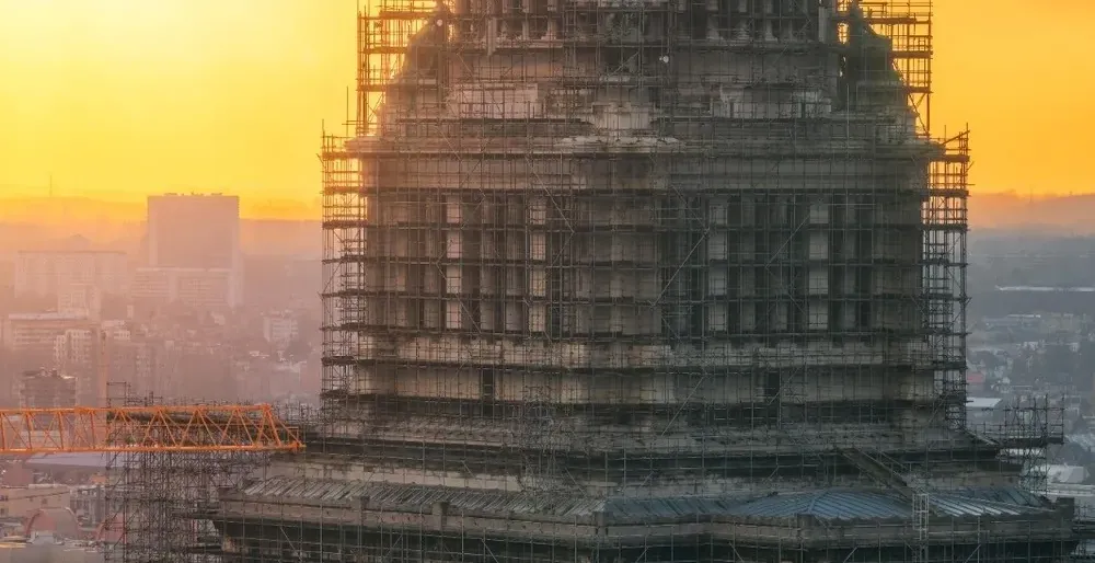 The Palace of Justice in Brussels at sunset, undergoing renovations.