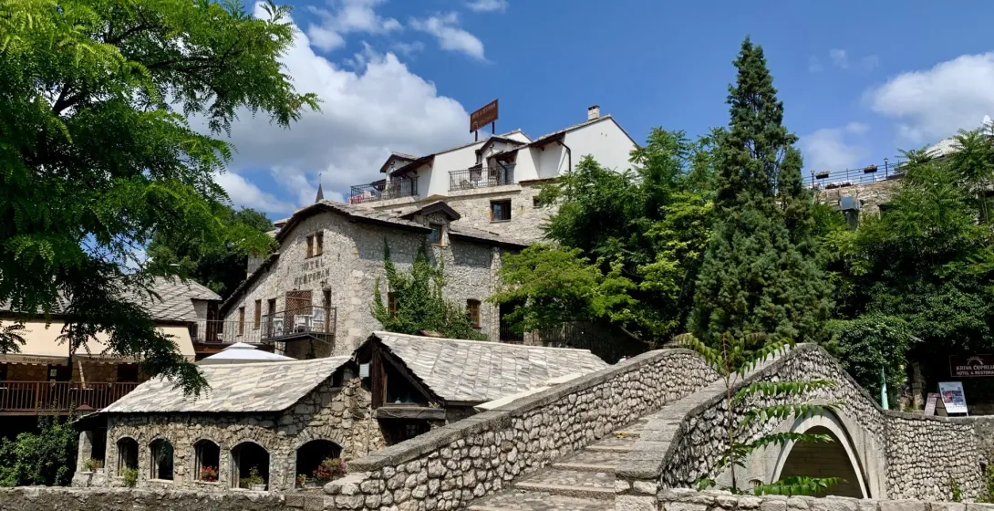 Stone bridge leading to a hotel in Kotor's Old Town, Montenegro.