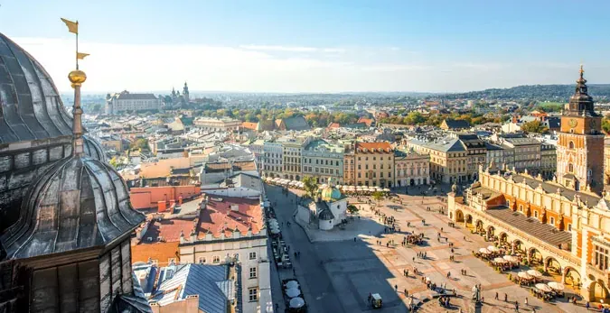 Panoramic view of Krakow's Main Market Square and Wawel Castle.