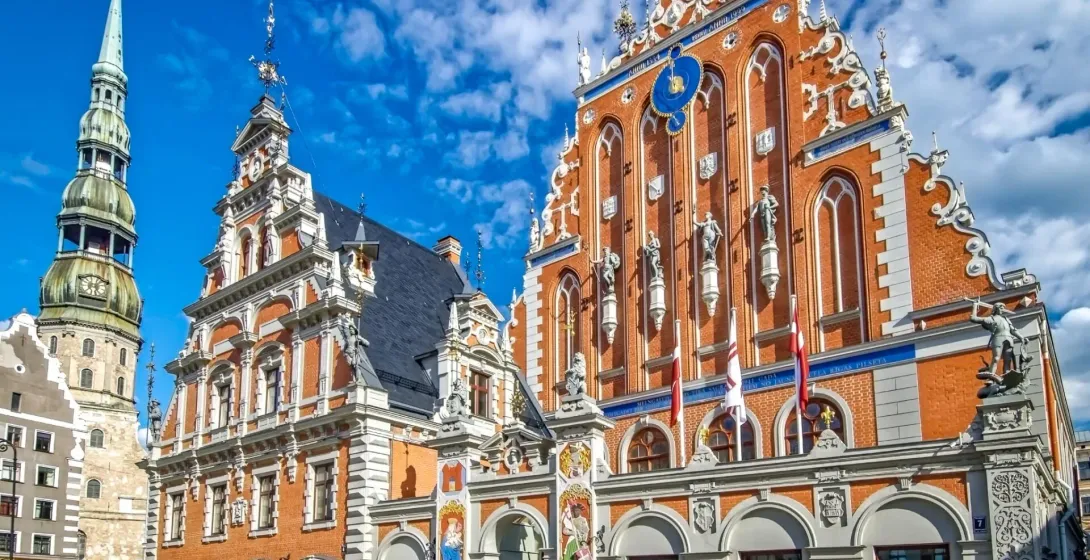 Explore Riga's Old Town: House of the Blackheads & St. Peter's Church.
