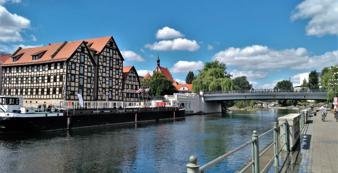 Bydgoszcz cityscape with river and architecture.