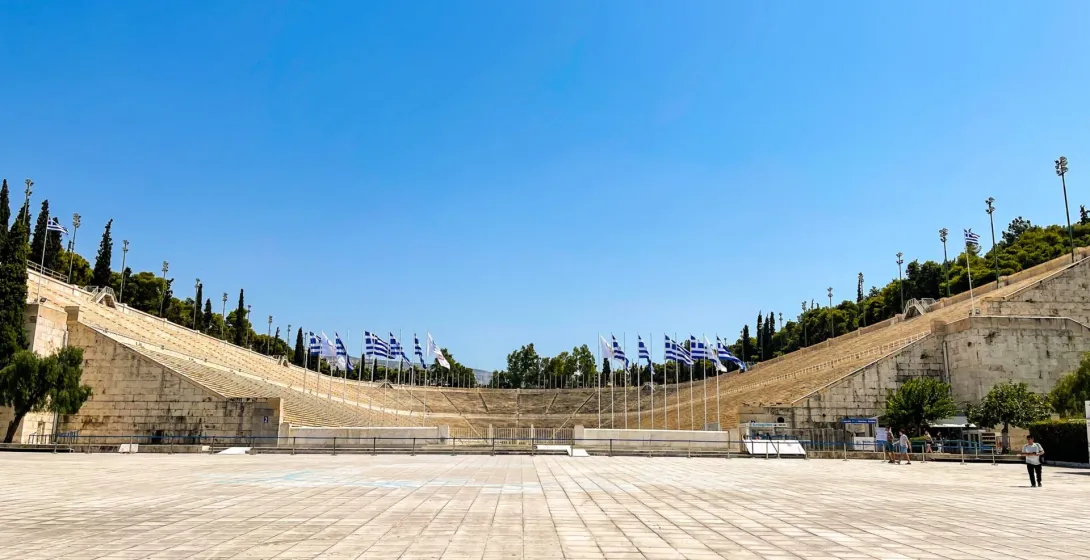 Panathenaic Stadium in Athens, Greece, a stunning marble stadium under a clear blue sky.