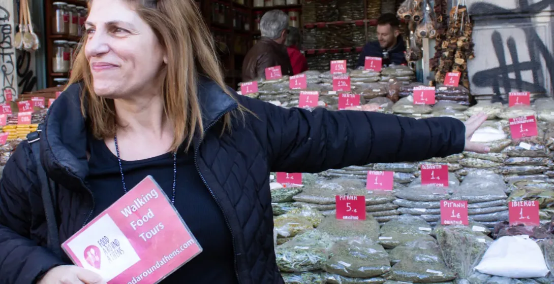 A tourist on a food tour in Athens, Greece, explores a vibrant spice shop.