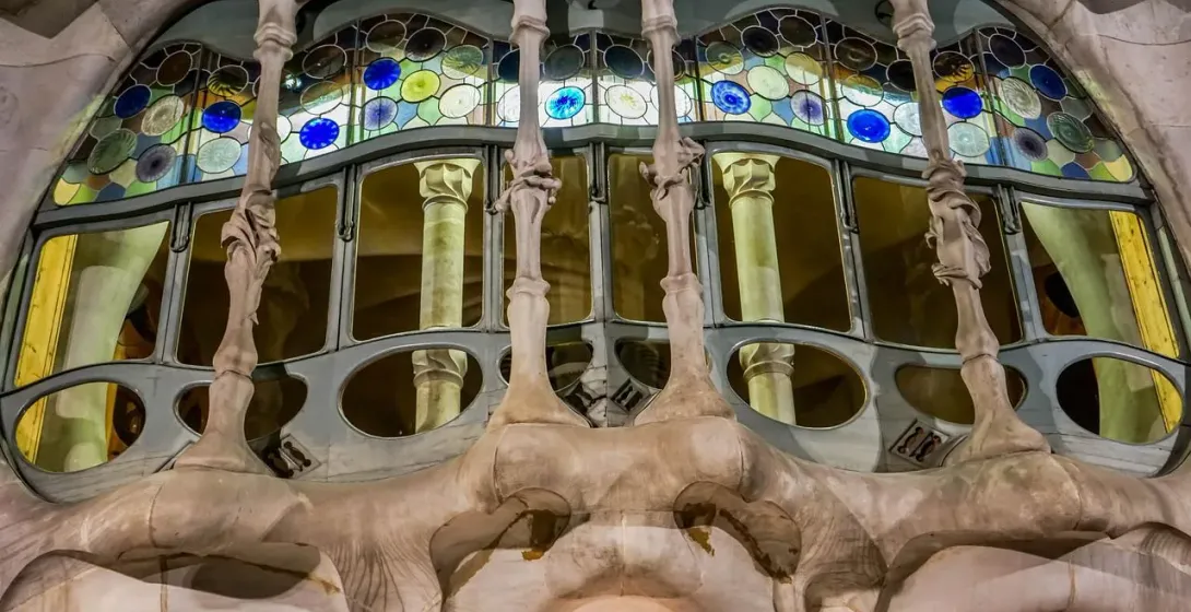 Intricate stained-glass window detail at Casa Batlló in Barcelona.