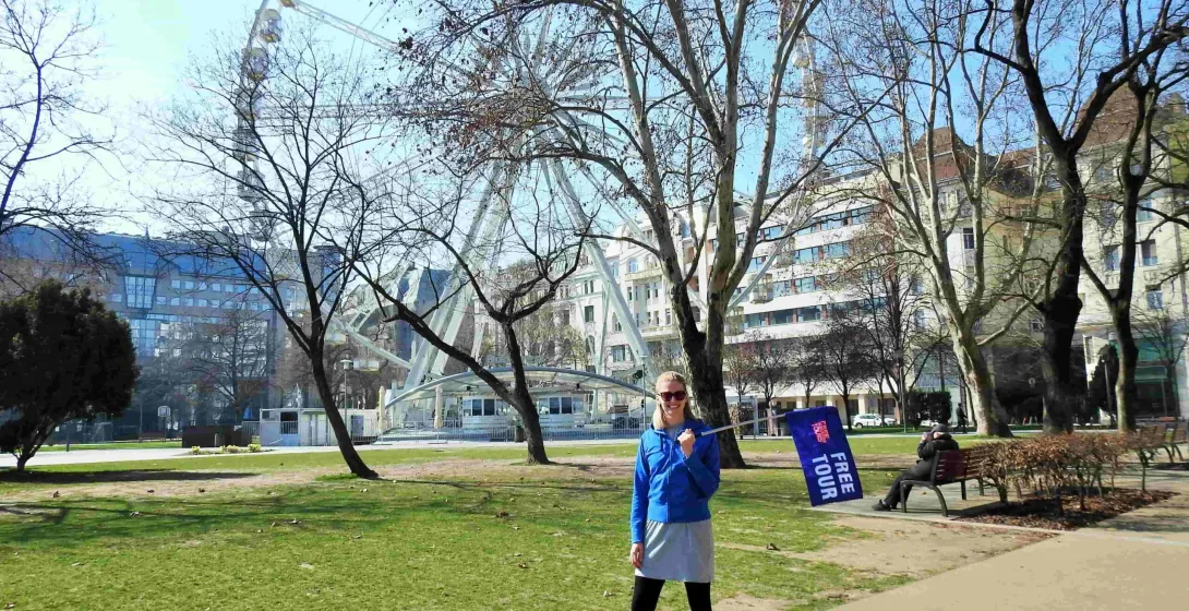 A Free Tour guide in Budapest stands near the Budapest Eye.