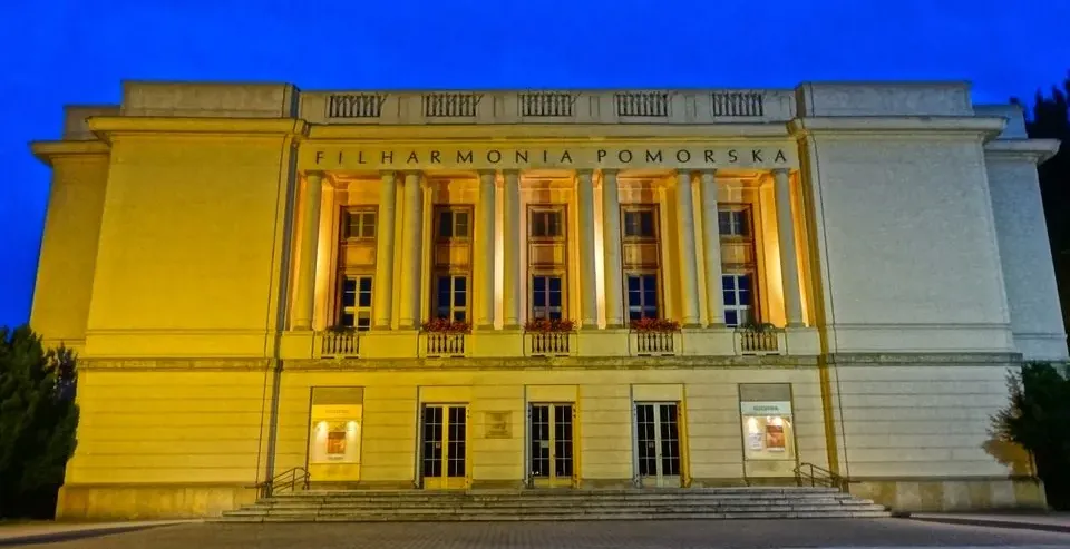 The grand Filharmonia Pomorska in Bydgoszcz, Poland, illuminated at night.