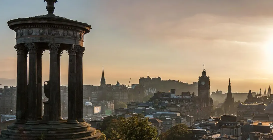 Edinburgh cityscape with Dugald Stewart Monument at sunrise.
