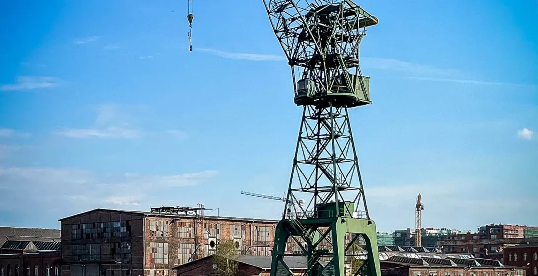 A large green harbor crane in Gdansk, Poland.