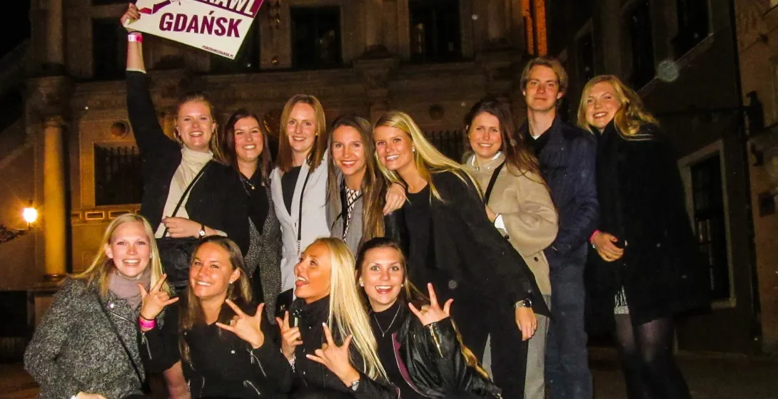 Happy tourists on a Gdansk pub crawl.