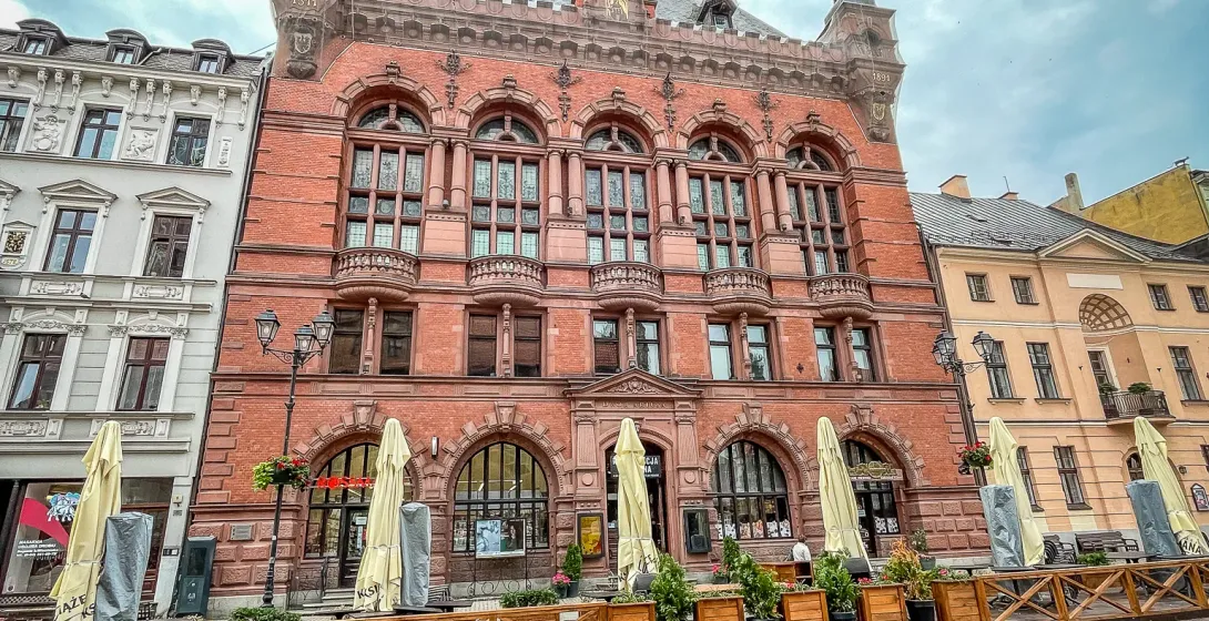 A beautiful brick building in a German city square.