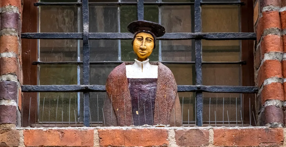 Ceramic sculpture in a historic German window.