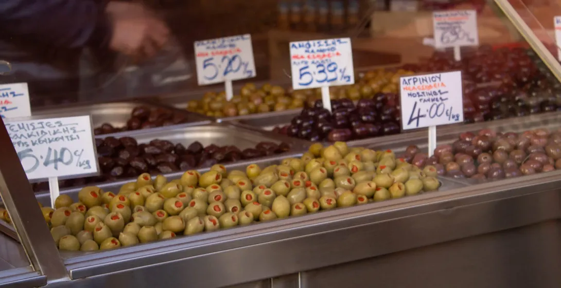 Assorted olives on display at a Greek market.