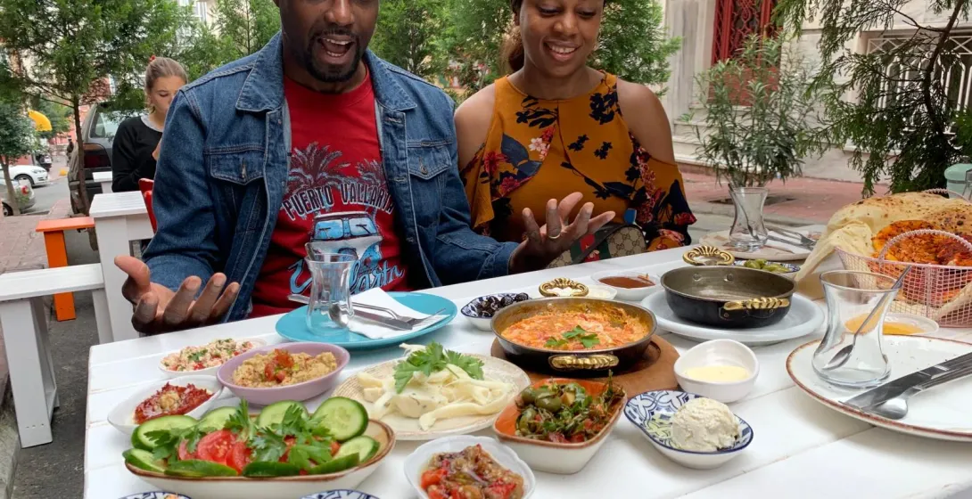 Couple enjoying a delicious Turkish breakfast in Istanbul.