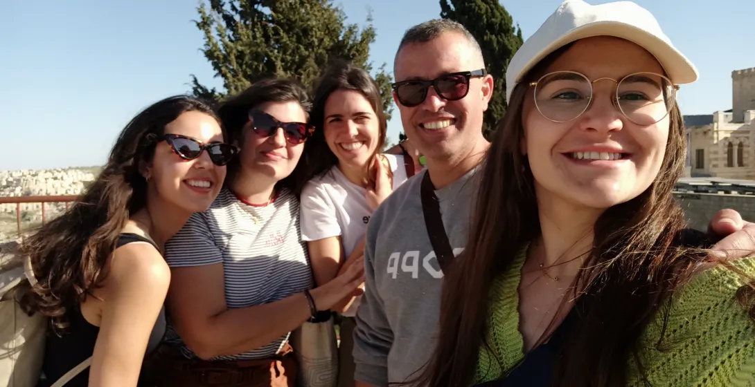Happy tourists on a guided tour in Jerusalem's Old City.