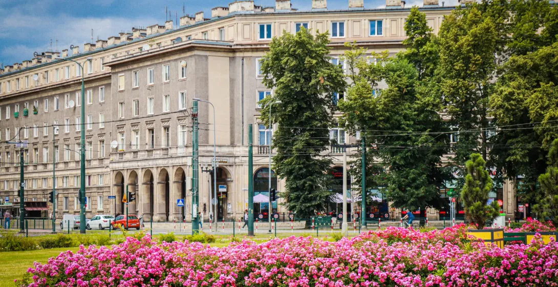 A guided walking tour of Communist Krakow's Nowa Huta district, featuring beautiful architecture and vibrant flowerbeds.