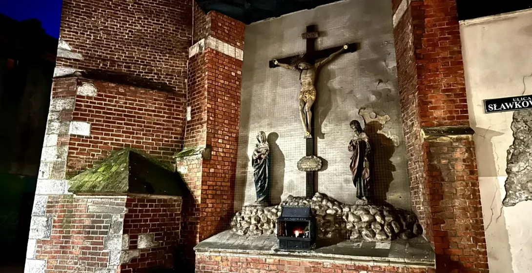 Nighttime view of a religious shrine in Krakow, Poland.