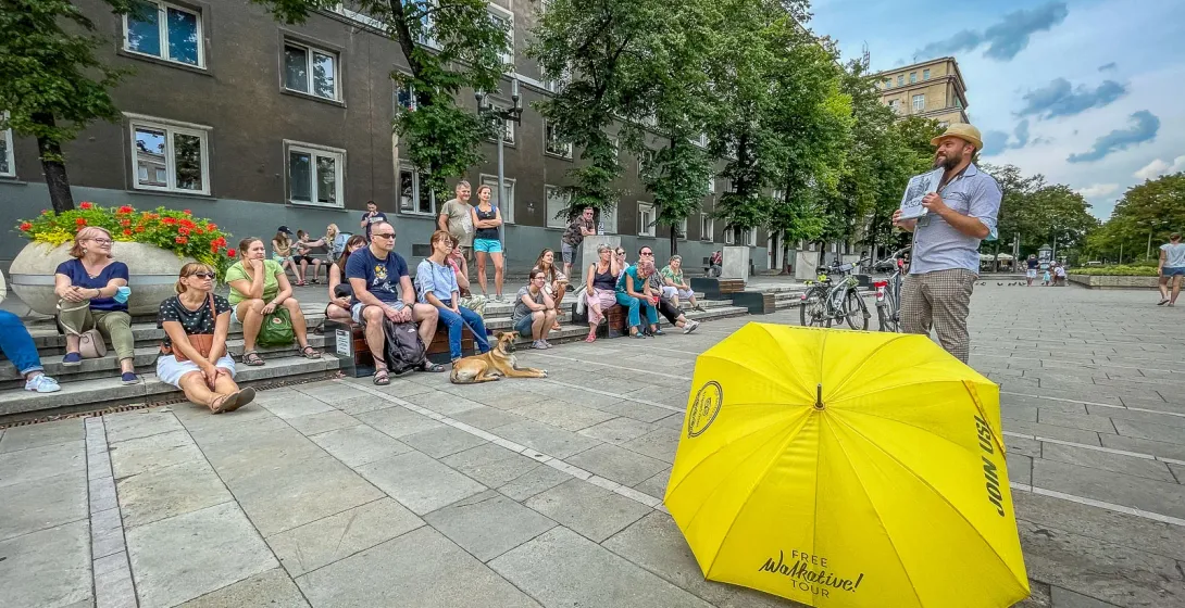 A large group enjoys a free Walkative! walking tour in Krakow, Poland.
