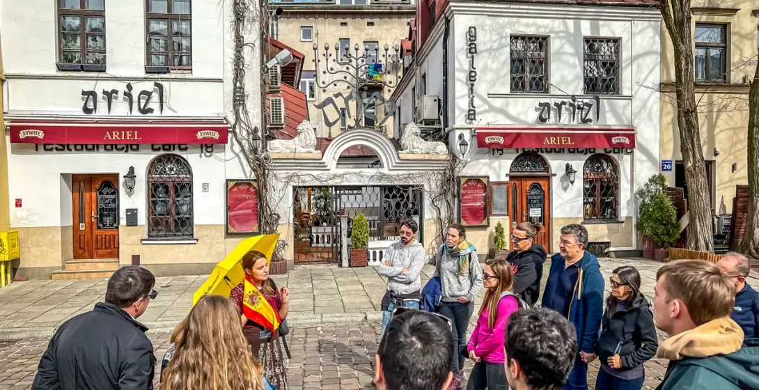 Guided tour group in Krakow's Kazimierz district, outside the Ariel Restaurant.