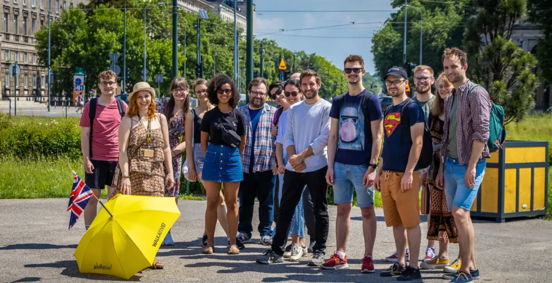 Happy tourists on a Walkative! walking tour in Krakow.