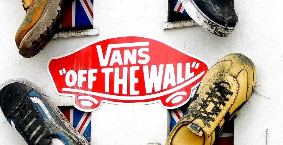 Giant shoes adorn a building in London, creating a fun and unique street scene.