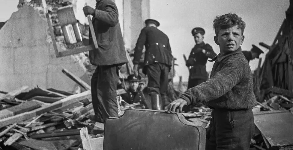 London children amidst WWII rubble.