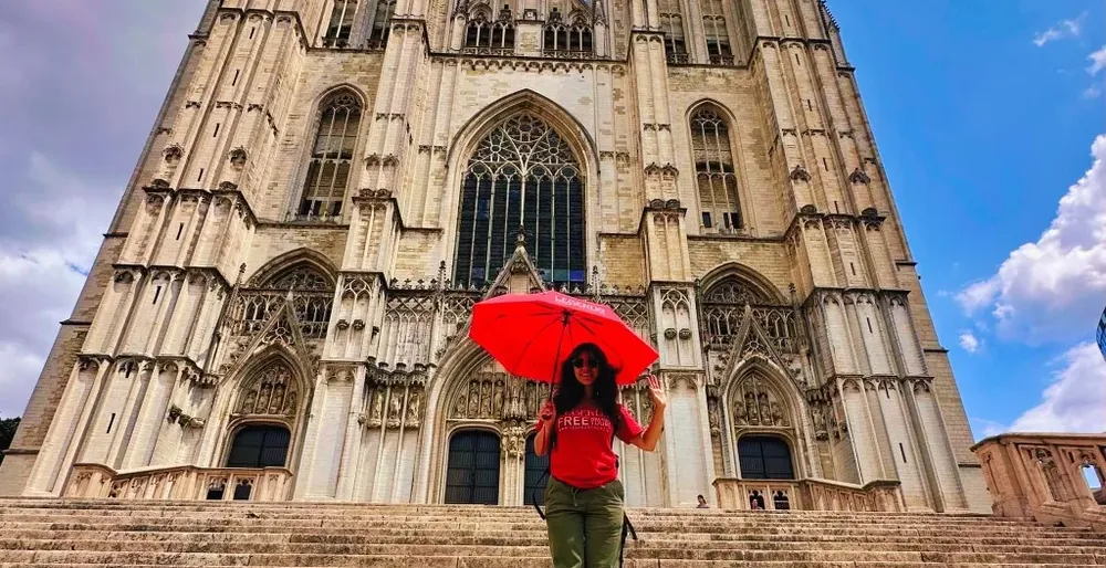 Tourist at St. Rumbold's Cathedral in Mechelen, Belgium.