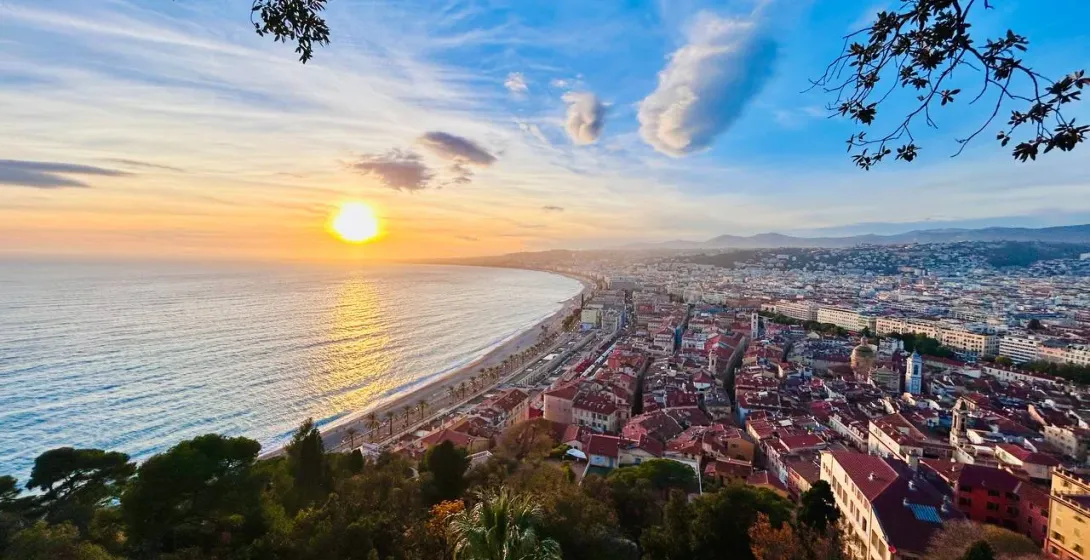 Stunning sunset over Nice, France, showcasing the city's coastline and architecture.