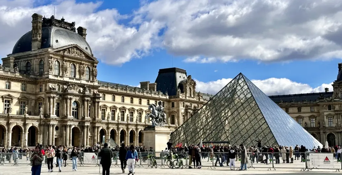 Tourists visiting the Louvre Museum in Paris, France.