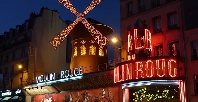 The dazzling Moulin Rouge in Paris at night.