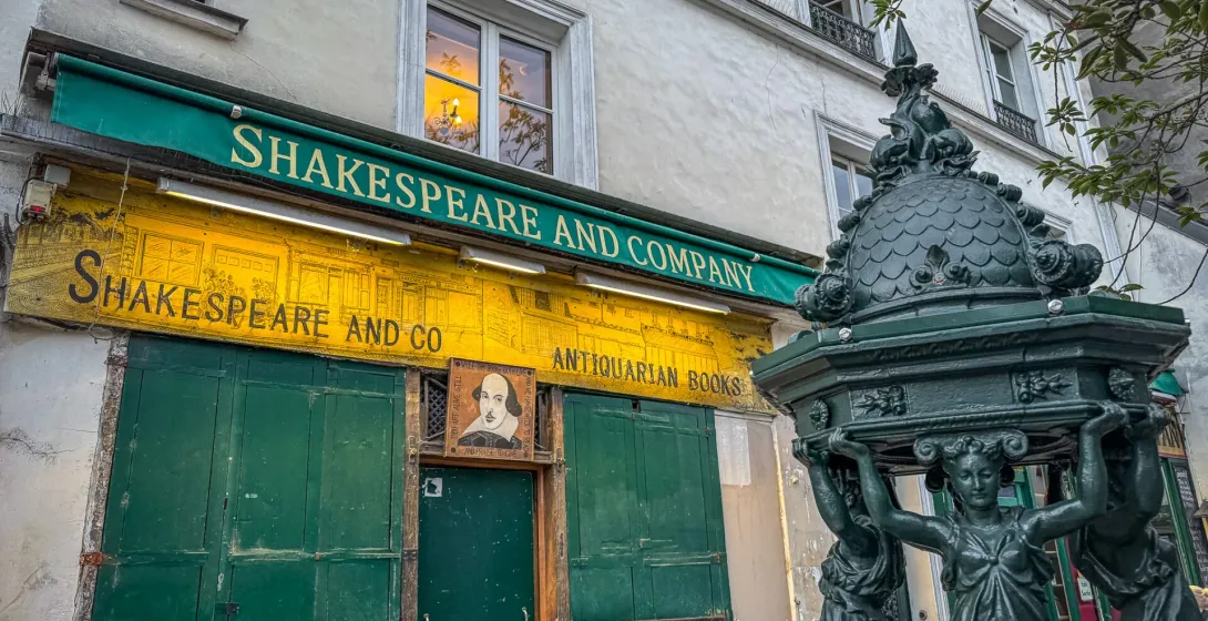 Shakespeare and Company bookstore in Paris, with a charming antique fountain.