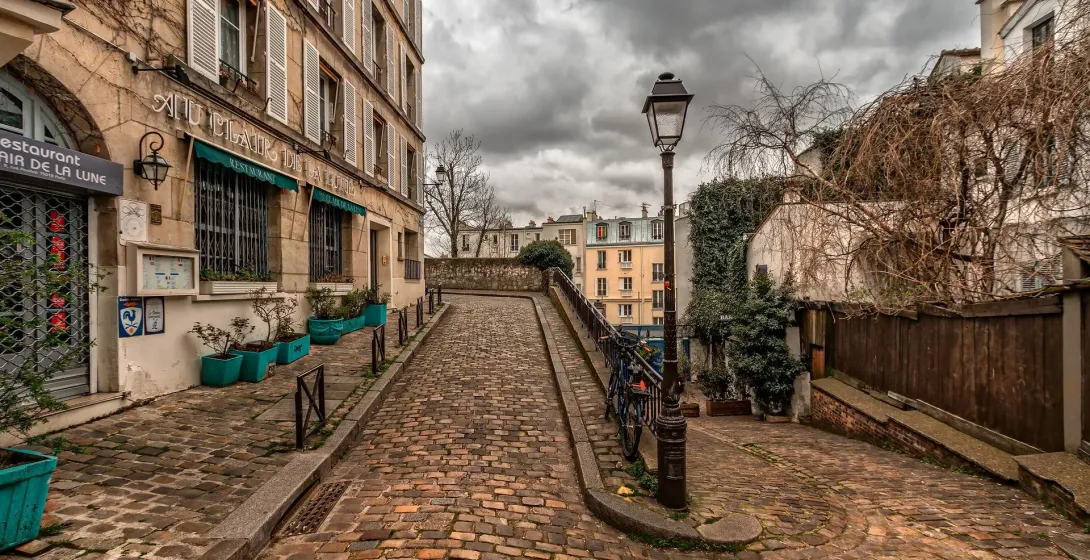 Charming cobblestone street in Paris, France.