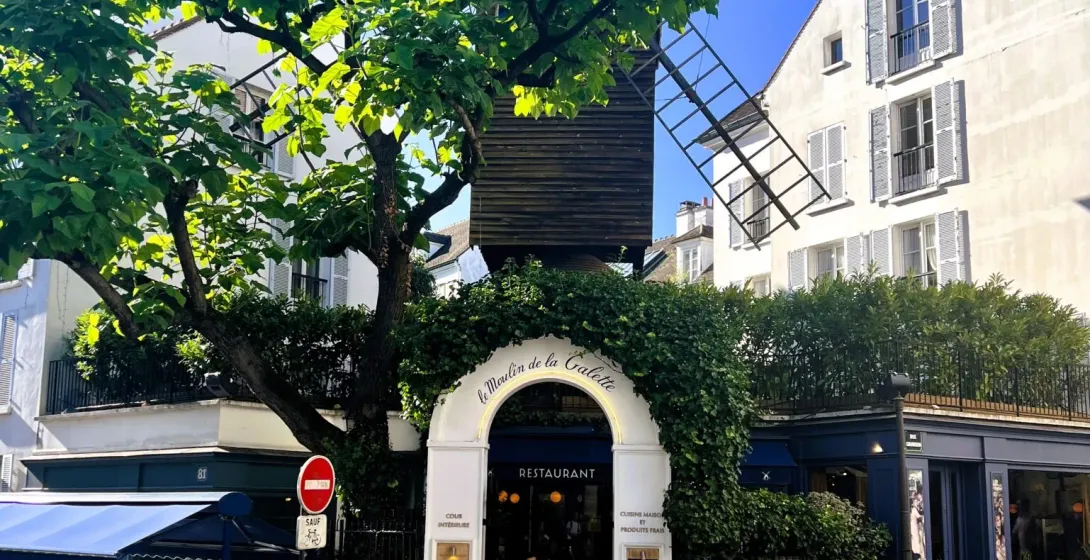 Le Moulin de la Galette restaurant in Montmartre, Paris, with its iconic windmill.