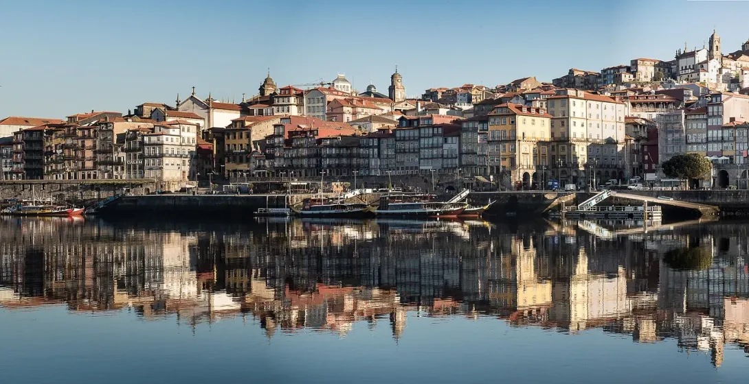 Stunning reflection of Porto's Ribeira district in the Douro River.