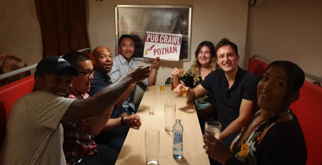 Happy tourists enjoying a Poznan Pub Crawl.
