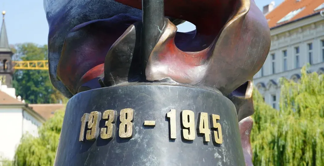 Close-up of a bronze sculpture in Prague, commemorating 1938-1945.