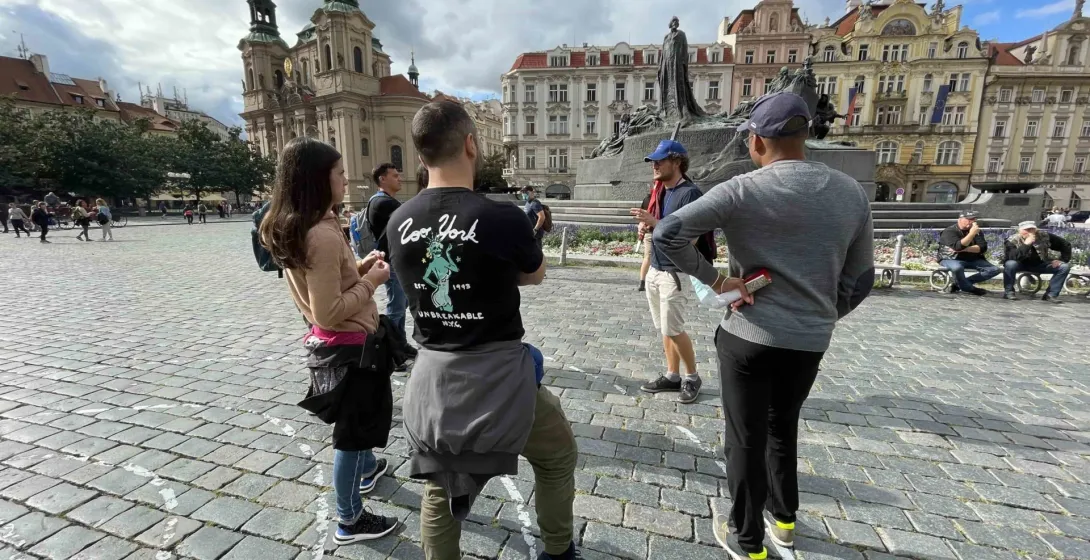 Guided tour group in Prague's Old Town Square.