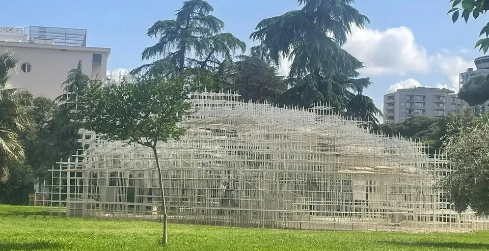 The Serpentine Pavilion in Rome, a stunning temporary installation in a green park.