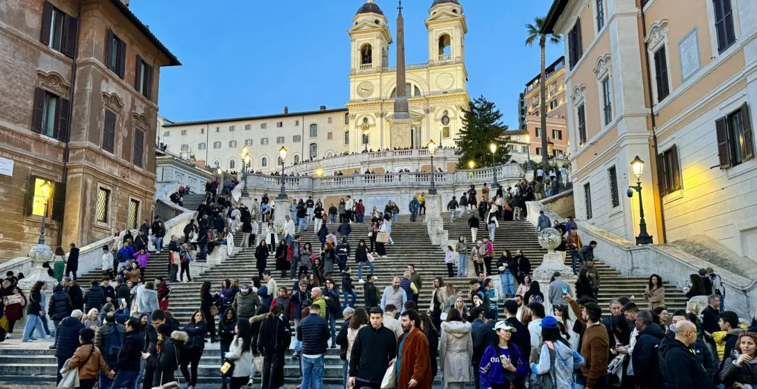 Tourists enjoying the Spanish Steps in Rome at dusk.