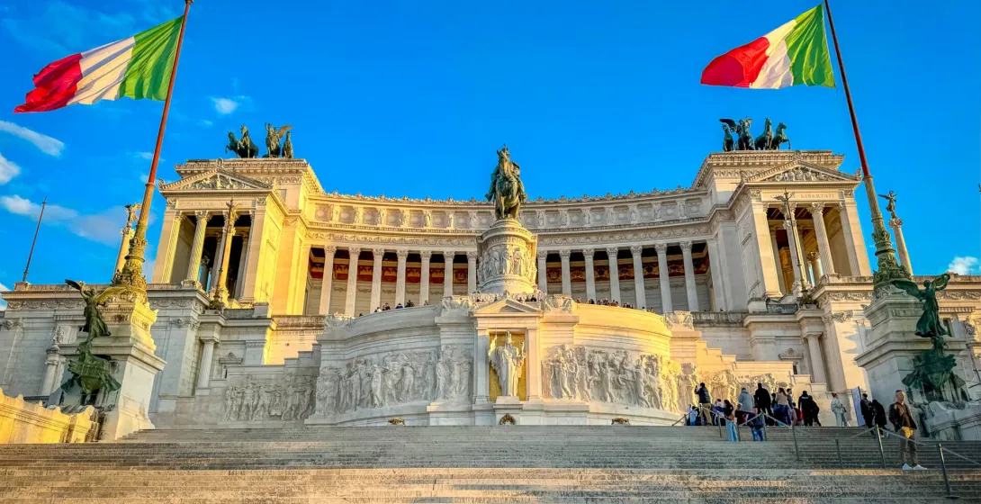 Tourists ascending the grand staircase of the Vittoriano monument in Rome, Italy.