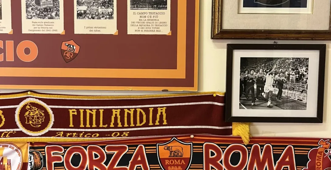 AS Roma memorabilia displayed on a wall in Rome.