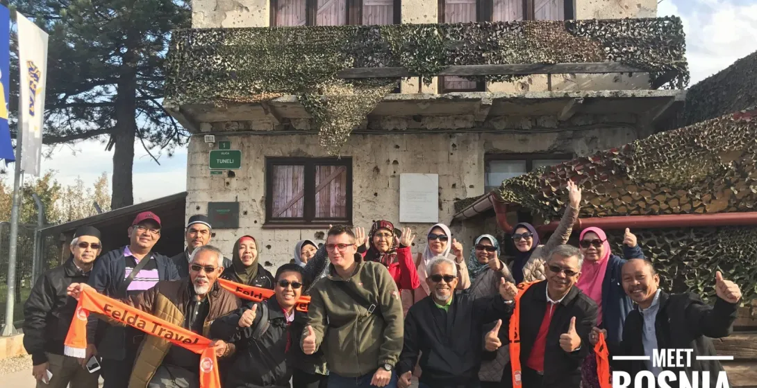 Happy tour group at the Tunnel of Hope in Sarajevo.