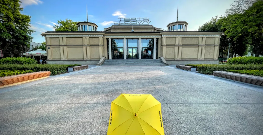Yellow umbrella in front of the Ludowy Theatre in Sopot, Poland.