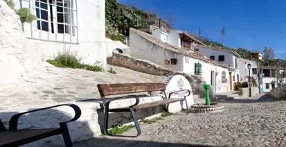 Picturesque Spanish village with whitewashed houses and cobblestone streets.