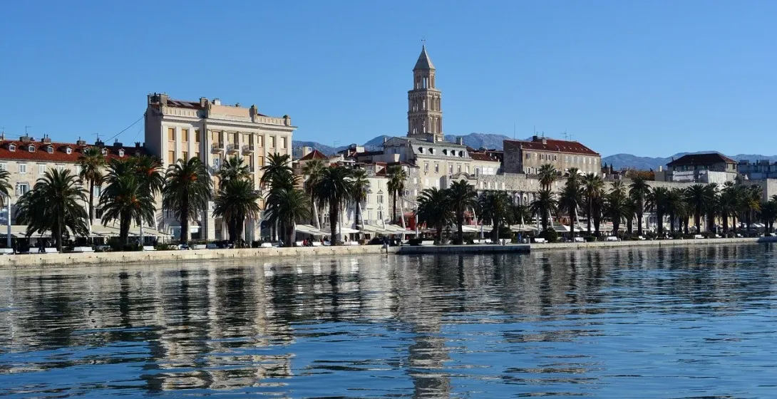 Stunning reflection of Split's waterfront on a calm sea.