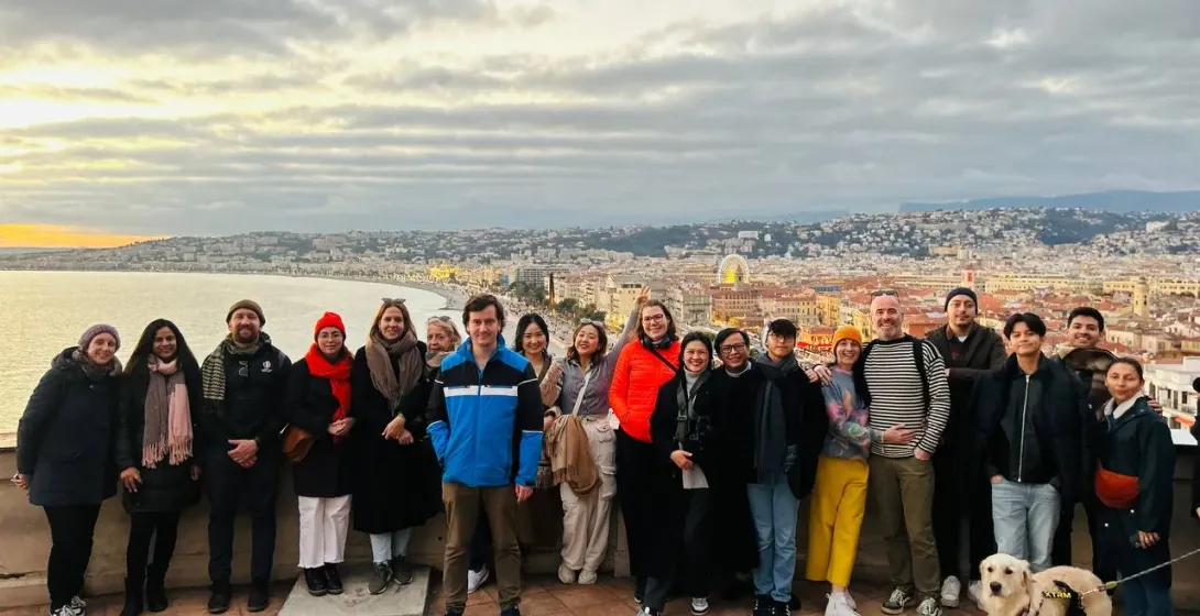 Group of tourists enjoying a panoramic view of Nice.