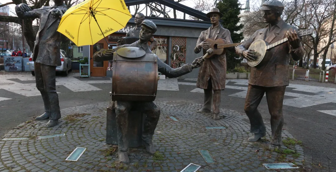 Bronze statue of a street band in Warsaw, Poland.