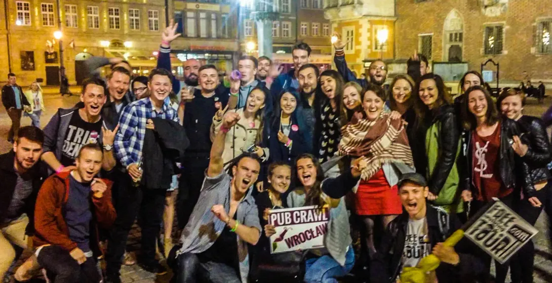 Happy tourists on a Wrocław pub crawl.