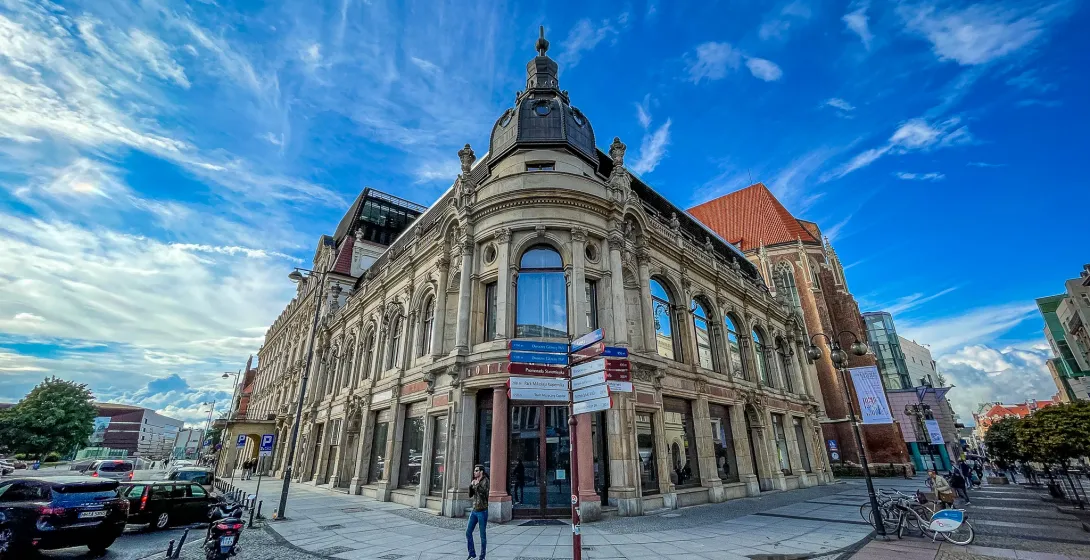 A beautiful building in Wroclaw, Poland, under a bright blue sky.