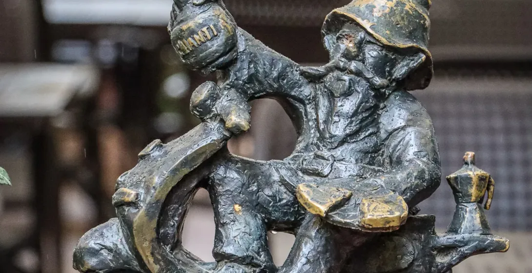 Bronze dwarf statue on a scooter in Wroclaw, Poland.